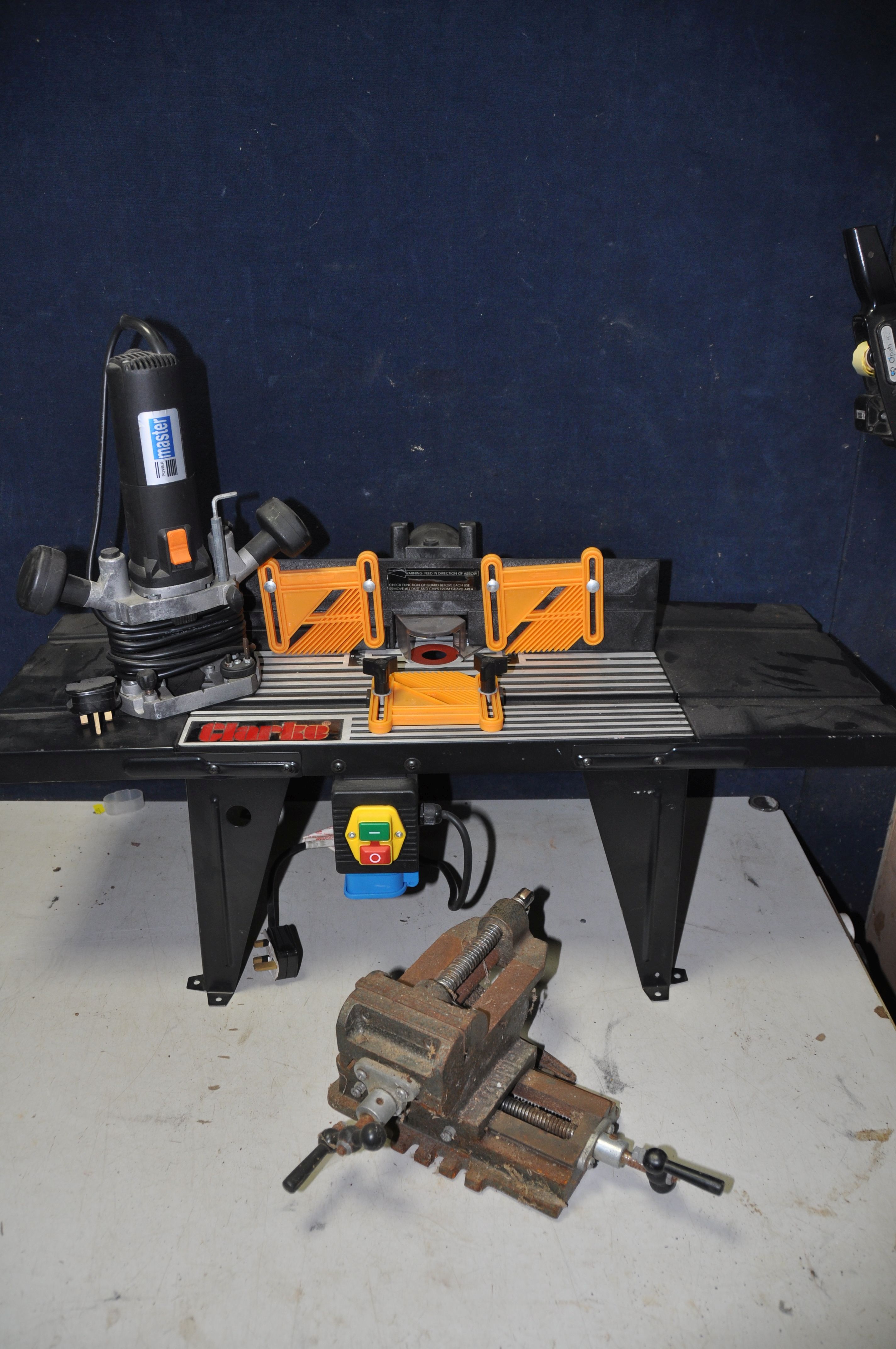 A CLARKE CRT-1 ELECTRIC TABLE TOP along with a Power Master electric router, Jacob cross vice and