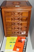 A MAH JONG SET, the set of bamboo tiles contained in a wooden case with five drawers, height 32.