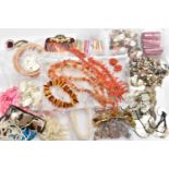 A BOX OF ASSORTED JEWELLERY, to include a stretch link polished copal amber bracelet, a coral