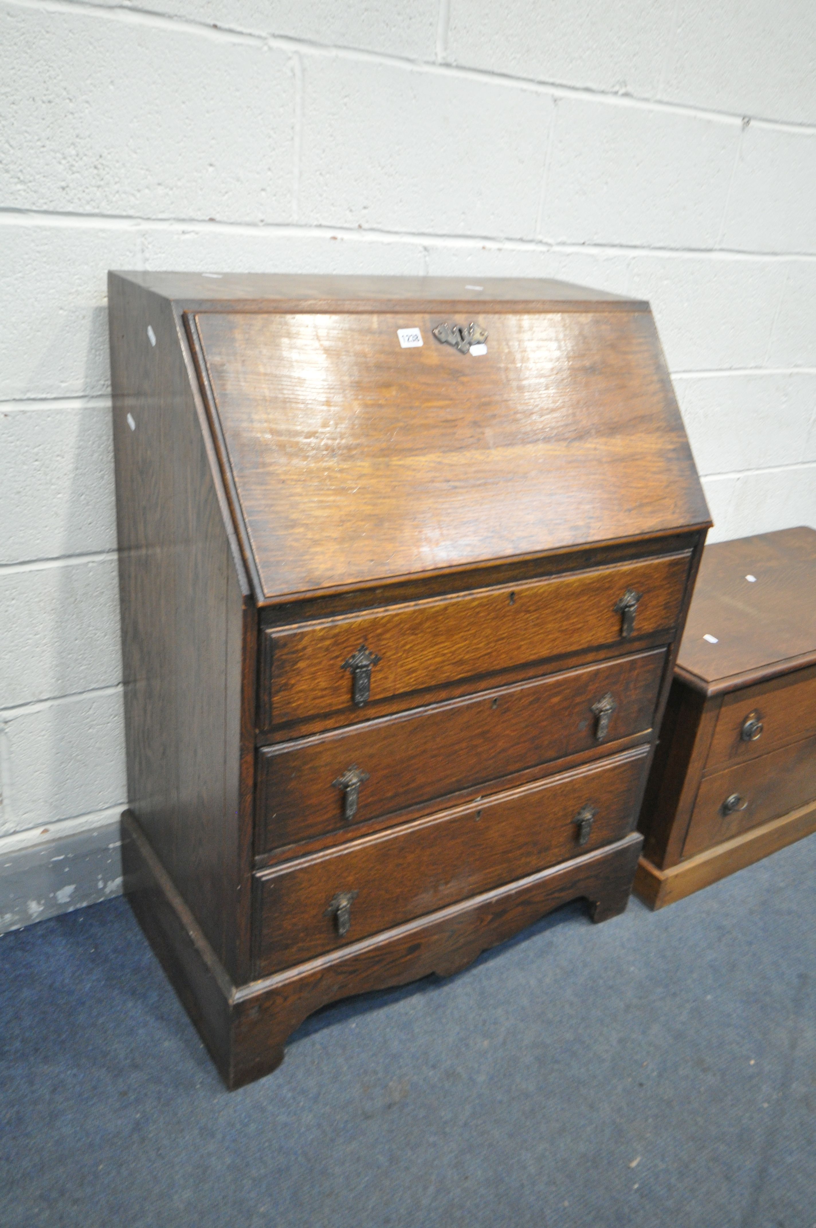 AN OAK FALL FRONT BUREAU, with fitted interior, above three graduated drawers, width 74cm x depth - Bild 2 aus 3