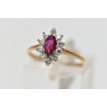 A 9CT YELLOW AND WHITE GOLD RUBY AND DIAMOND CLUSTER RING, set with a marquise shape ruby, within