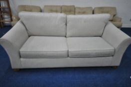 A CREAM UPHOLSTERED TWO SEATER SOFA, length 220cm