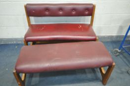 A BURGUNDY LEATHER BENCH, with pine frame, along with a matching stool (condition - tears and cracks