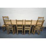 A SOLID OAK EXTENDING DINING TABLE, with two additional leaves, open length 226cm x closed 150cm x