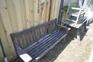A WEATHER TEAK GARDEN TABLE AND BENCH (condition:-bench part loose and distressed) along with a