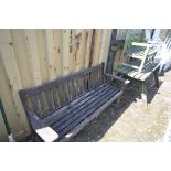 A WEATHER TEAK GARDEN TABLE AND BENCH (condition:-bench part loose and distressed) along with a