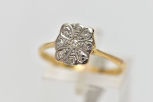 A YELLOW METAL DIAMOND DRESS RING, designed as a series of single cut diamonds set within a floral