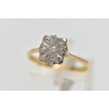 A YELLOW METAL DIAMOND DRESS RING, designed as a series of single cut diamonds set within a floral