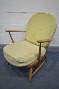 A BLONDE ERCOL WINDSOR MODEL 203 BEECH ARMCHAIR, with lime green cushions, width 69cm x depth 71cm x