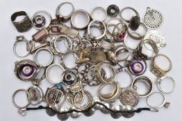 A LARGE ASSORTMENT OF WHITE METAL RINGS, to include dress and fashion rings, together with an