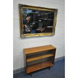 AN GILT FRAMED BEVELLED EDGE WALL MIRROR, 106cm x 75cm, an oval mahogany coffee table, and a mid-