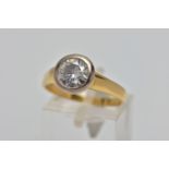 AN 18CT GOLD SINGLE STONE MOISSANITE RING, circular cut moissanite in a white metal collet