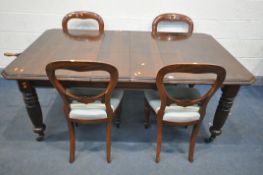 A VICTORIAN MAHOGANY WIND OUT DINING TABLE, with canted corners, two additional leaves, on fluted