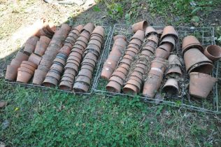 TWO TRAYS CONTAINING A QUANTITY OF TERRACOTTA PLANT POTS (condition:-mostly in poor condition, as