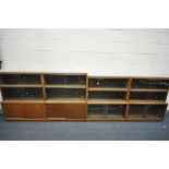 FOUR MID CENTURY MINTY TEAK SECTIONAL BOOKCASE, to include four bases, with twelve sections in