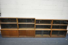 FOUR MID CENTURY MINTY TEAK SECTIONAL BOOKCASE, to include four bases, with twelve sections in