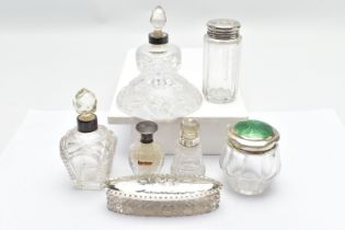 ASSORTED GLASS VANITY JARS, of various shapes, such as an elongated oval jar with an embossed cherub