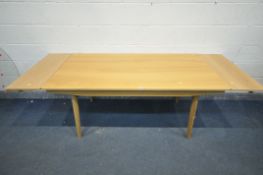 A JOHN LEWIS LIGHT OAK DINING TABLE, with two additional leaves/drawers, on cylindrical tapered