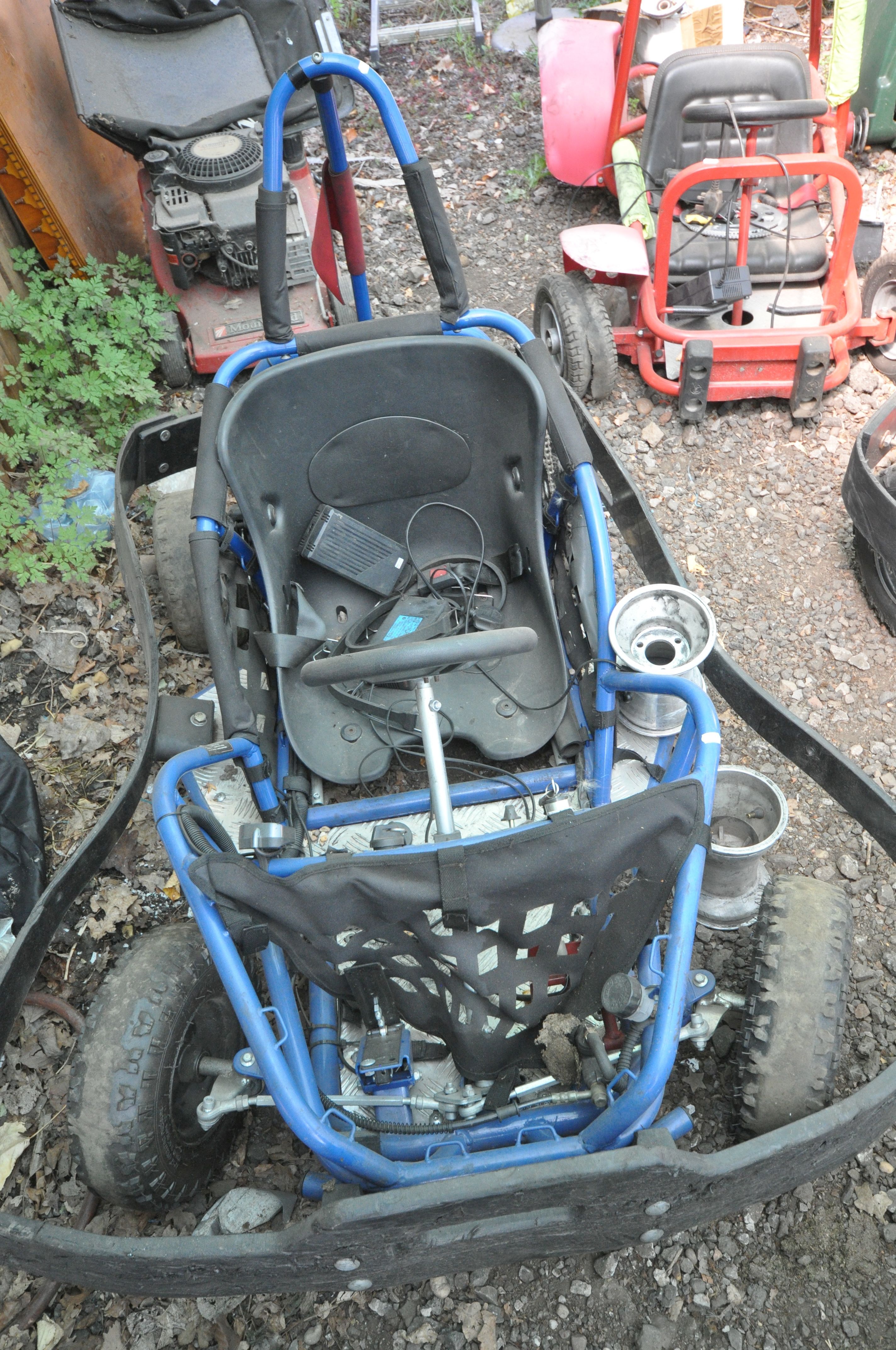 A HIGH PER OFF ROAD ELECTRIC GO CART looks to be fairly complete but missing batteries and