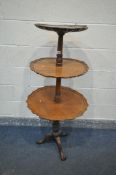 A REPRODUCTION WALNUT DUMB WAITER , with three graduated plateaus, wavy edges, turned and carved