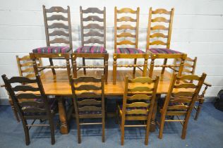 A REPRODUCTION OAK DRAW LEAF DINING TABLE, one additional leaf, along with a set of six ladder