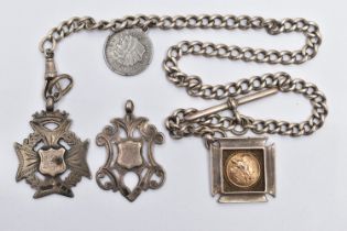 AN EARLY 20TH CENTURY SILVER ALBERT CHAIN WITH THREE SILVER FOBS, the curb link Albert chain with