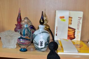 A COLLECTION OF DECORATIVE GLASS PERFUME BOTTLES, REFERENCE BOOKS AND TWO PAPERWEIGHTS, including an