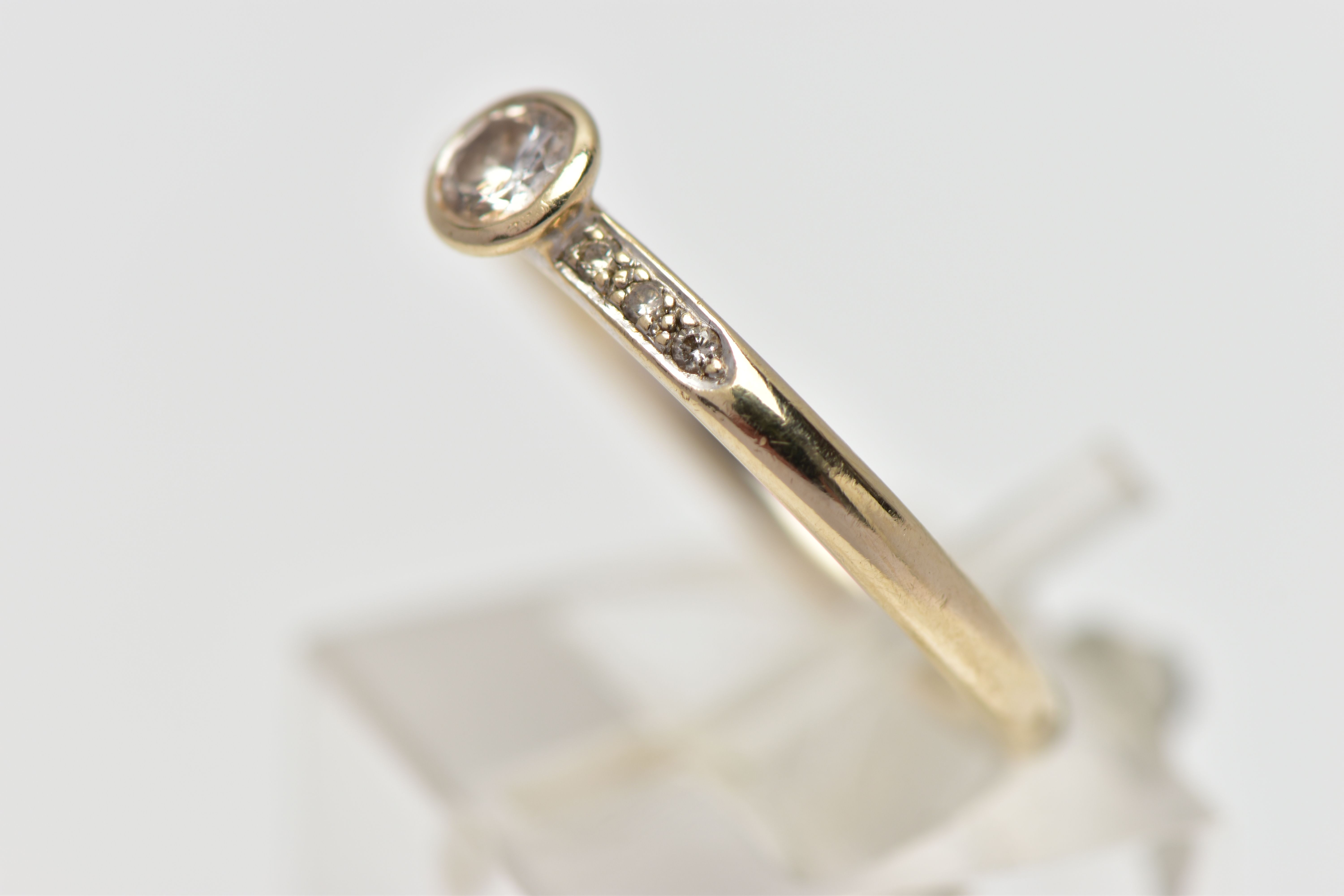 AN 18CT GOLD DIAMOND DRESS RING, the brilliant cut diamond within a collet setting, to the similarly - Image 2 of 4