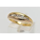 AN 18CT GOLD SEVEN STONE DIAMOND RING, designed as a graduated series of brilliant cut diamonds