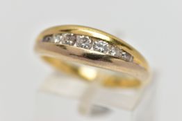 AN 18CT GOLD SEVEN STONE DIAMOND RING, designed as a graduated series of brilliant cut diamonds