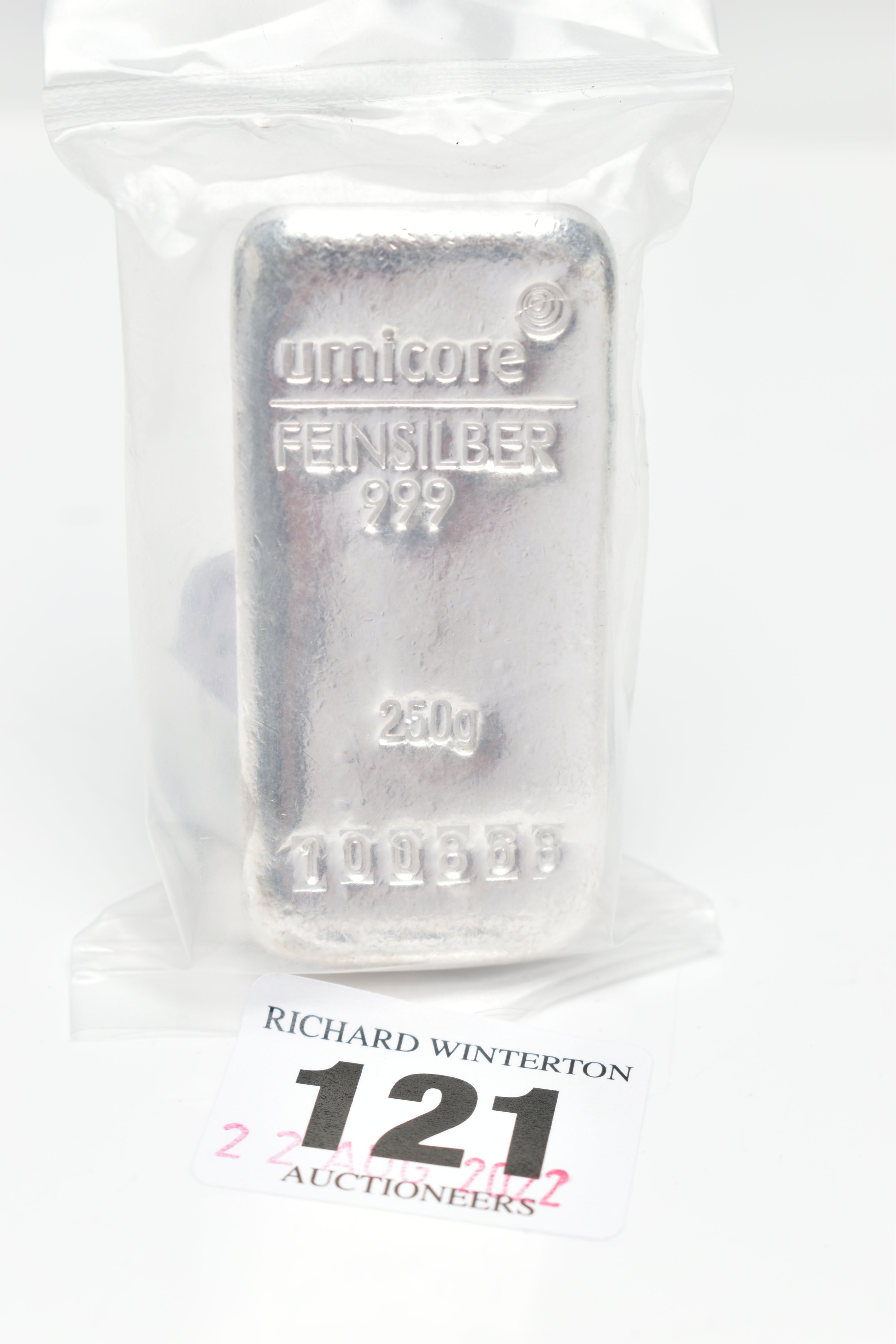 A 250 GRAM SILVER BAR, stamped 'Umicore Feinsilber 999, 250g, serial number 100868', in a sealed