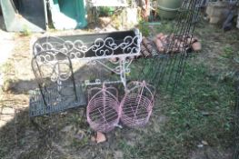 A QUANTITY OF METAL GARDEN ITEMS, to include a wrought iron rectangular planter on a stand, length