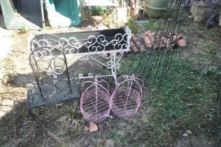 A QUANTITY OF METAL GARDEN ITEMS, to include a wrought iron rectangular planter on a stand, length