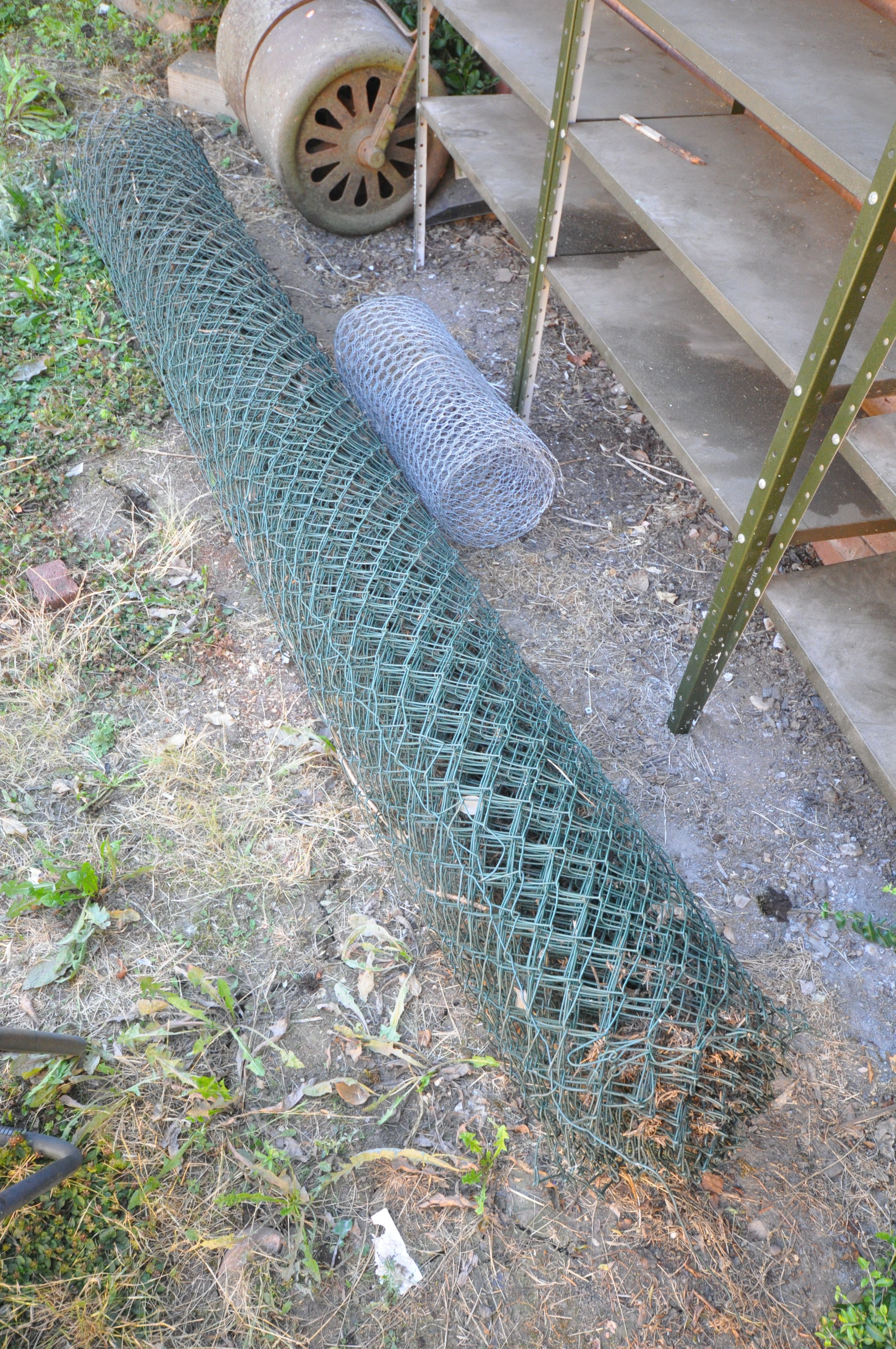 A LARGE ROLL OF STOCK WIRE FENCING, size unknown, and another roll of wire mesh (2)