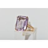 A 9CT GOLD AMETHYST SINGLE STONE RING, the rectangular shape amethyst measuring approximately 14mm x