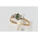 A 9CT GOLD EMERALD AND DIAMOND DRESS RING, the marquise cut emerald, with a trefoil of single cut