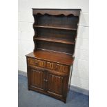 AN OAK LINENFOLD DRESSER, with two drawers, width 96cm x depth 46cm x height 179cm