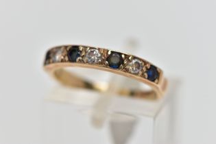 A 9CT GOLD SAPPHIRE AND DIAMOND HALF ETERNITY RING, designed with a row of four claw set, circular