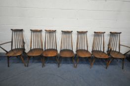 A SET OF SEVEN ERCOL ELM AND BEECH GOLDSMITH DINING CHAIRS, including two carvers (condition - ideal