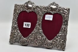 A MODERN SILVER PHOTO FRAME, of a rectangular form, embossed floral and scroll design featuring