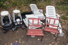 THREE WHITE PLASTIC FOLDING GARDEN LOUNGERS, a similar green lounger, two Little Tykes pedal buggies