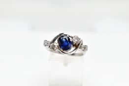 AN 18CT WHITE GOLD SAPPHIRE AND DIAMOND DRESS RING, the oval shape sapphire measuring