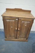 A 20TH CENTURY PINE TWO DOOR CABINET, with a raised back, width 79cm x depth 47cm x height 98cm (