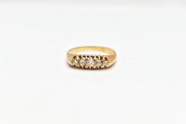AN 18CT GOLD DIAMOND RING, a yellow gold boat ring, set with five old cut diamonds in a prong