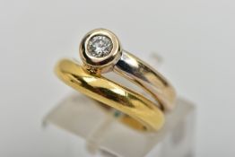 A YELLOW AND WHITE METAL DIAMOND SINGLE STONE DRESS RING, set with a round brilliant cut diamond,