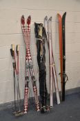 FOUR PAIRS OF SKI'S, brands include Head, Fischer and Blizzard along with nine ski sticks modern and