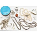 A SELECTION OF SILVER AND WHITE METAL JEWELLERY, to include an early 20th century silver circular