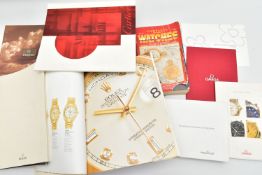 A SELECTION OF WATCH CATALOGUES AND BOOKLETS, to include an 'Omega collection' booklet, an '