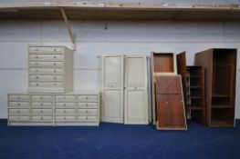 A CREAM BEDROOM SUITE, comprising a triple and double door wardrobes, triple door wardrobe