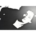 A MONOCHROMATIC STENCIL PORTRAIT DEPICTING A FEMALE FIGURE, indistinctly signed and dated '05?,